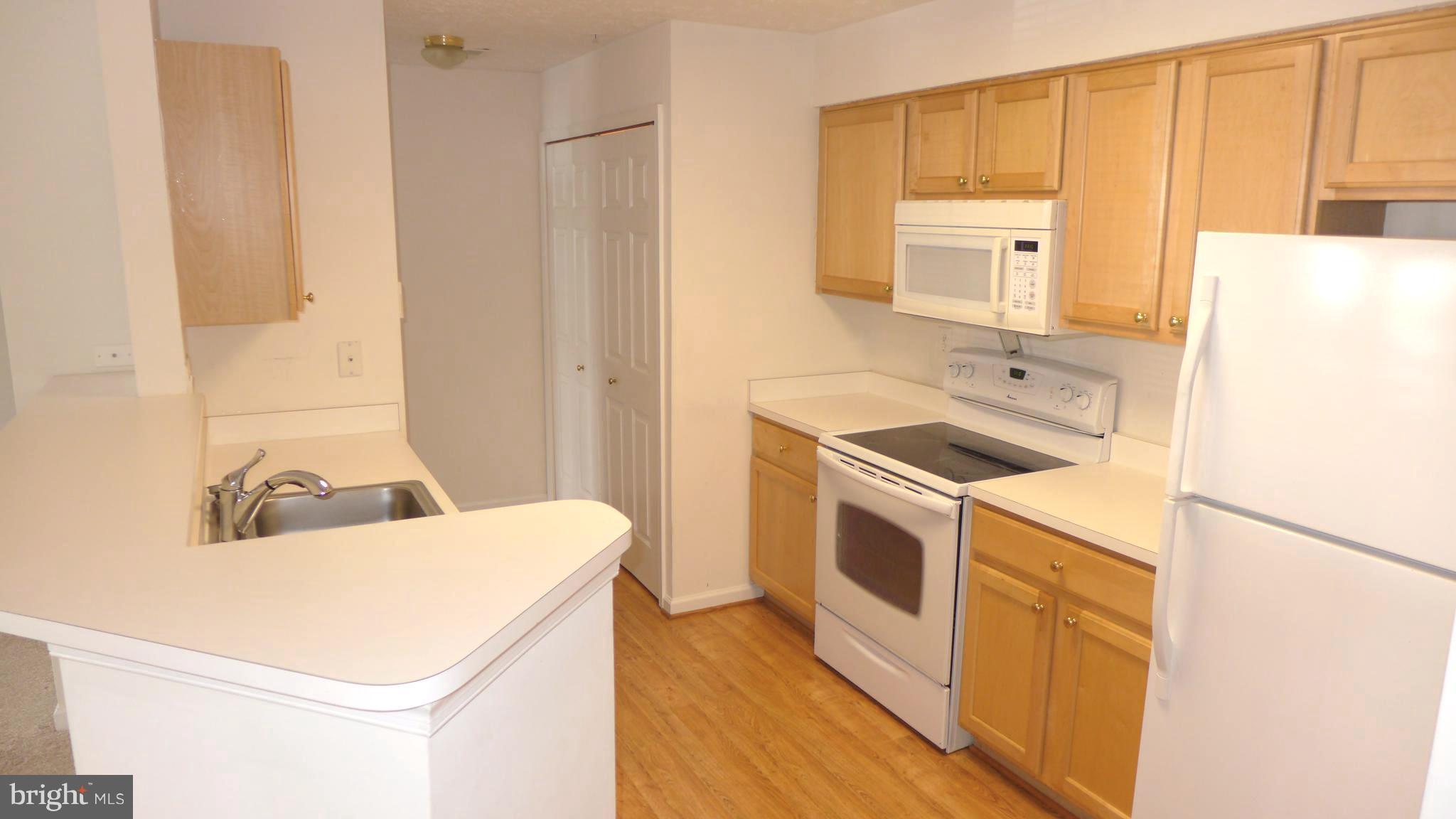 9746 Reese Farm Road, Unit 9746 Owings Mills, MD 21117 - Photo 12 of 22 a utility room with dryer and washer