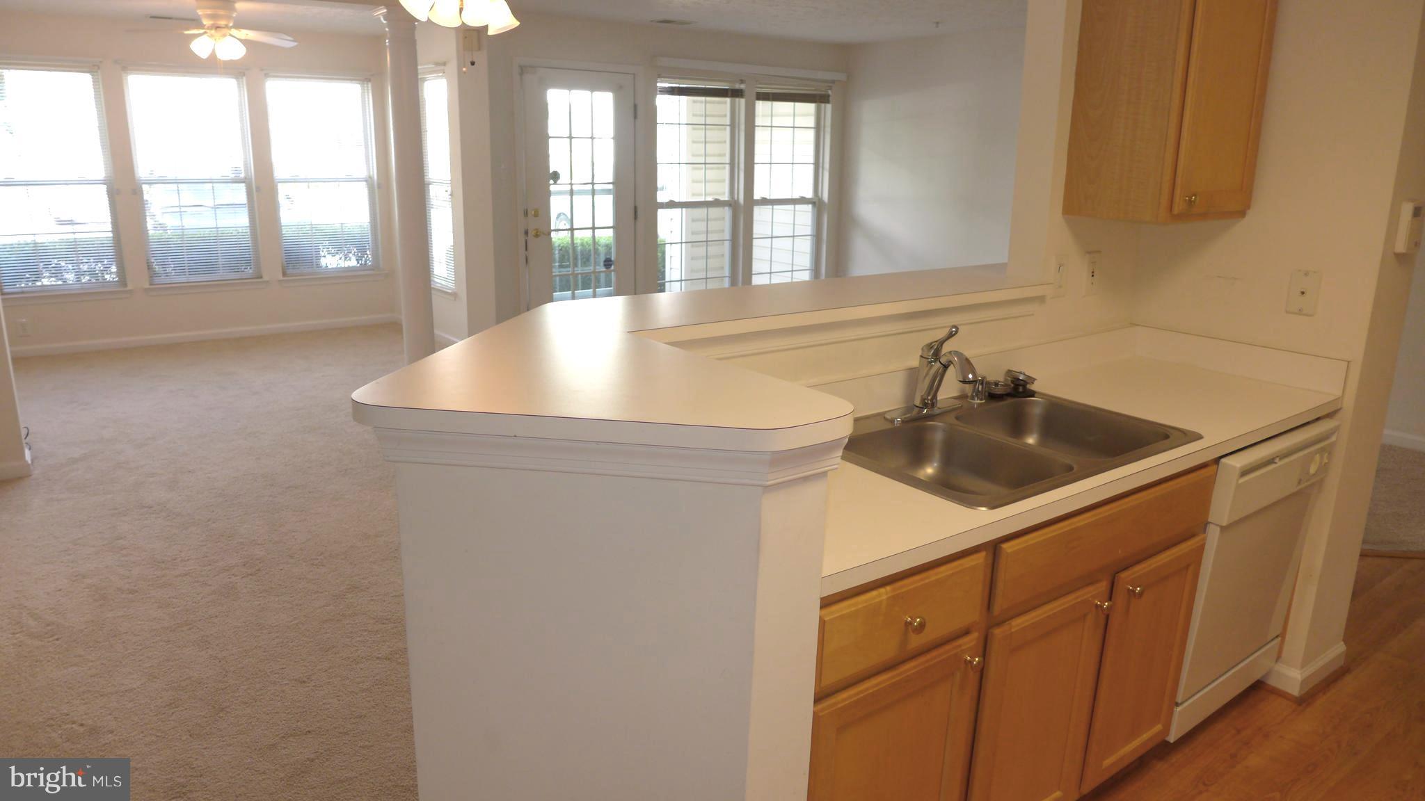 9746 Reese Farm Road, Unit 9746 Owings Mills, MD 21117 - Photo 13 of 22 a kitchen with a sink and large window