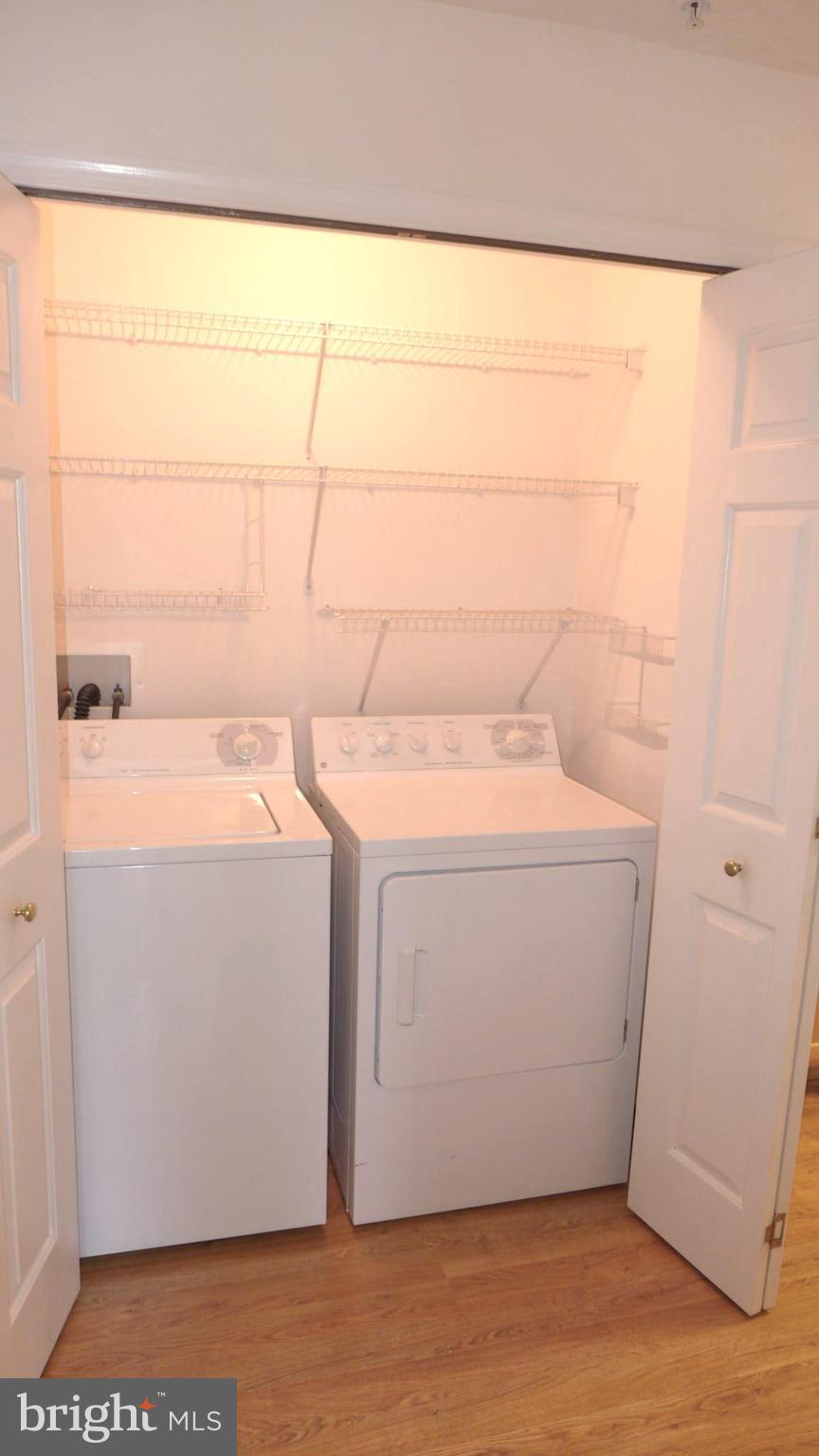 9746 Reese Farm Road, Unit 9746 Owings Mills, MD 21117 - Photo 14 of 22 a utility room with dryer and washer