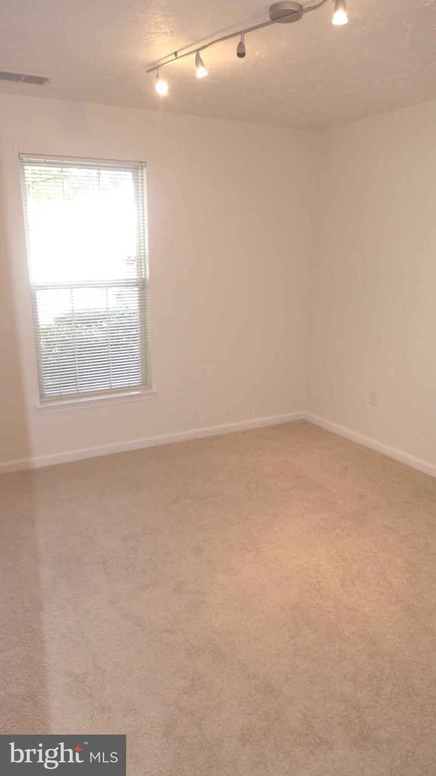 9746 Reese Farm Road, Unit 9746 Owings Mills, MD 21117 - Photo 19 of 22 an empty room with a window