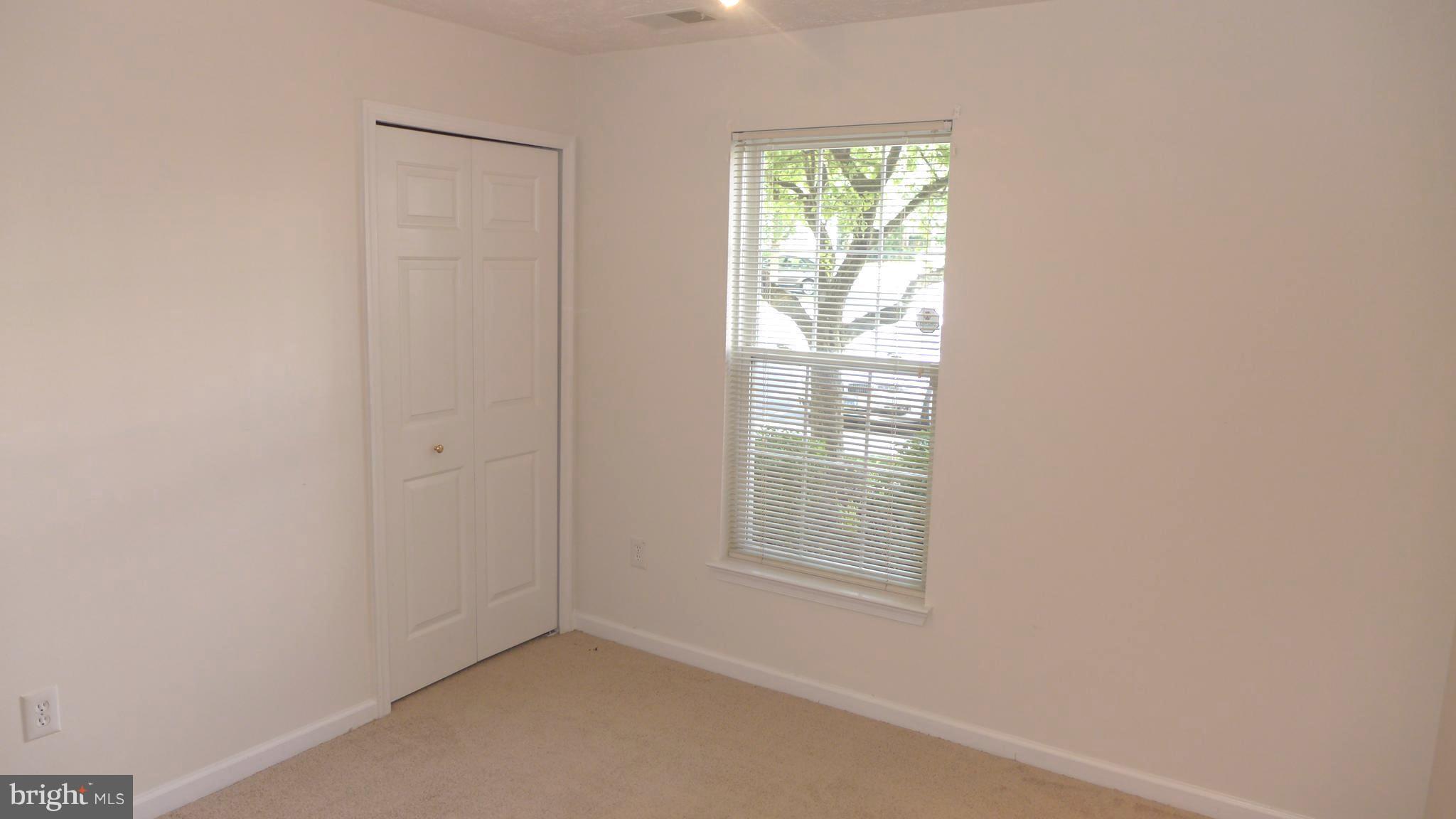 9746 Reese Farm Road, Unit 9746 Owings Mills, MD 21117 - Photo 20 of 22 an empty room with windows