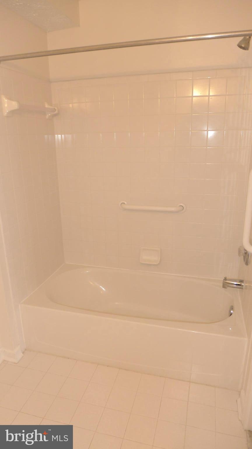 9746 Reese Farm Road, Unit 9746 Owings Mills, MD 21117 - Photo 22 of 22 a bathroom with a shower
