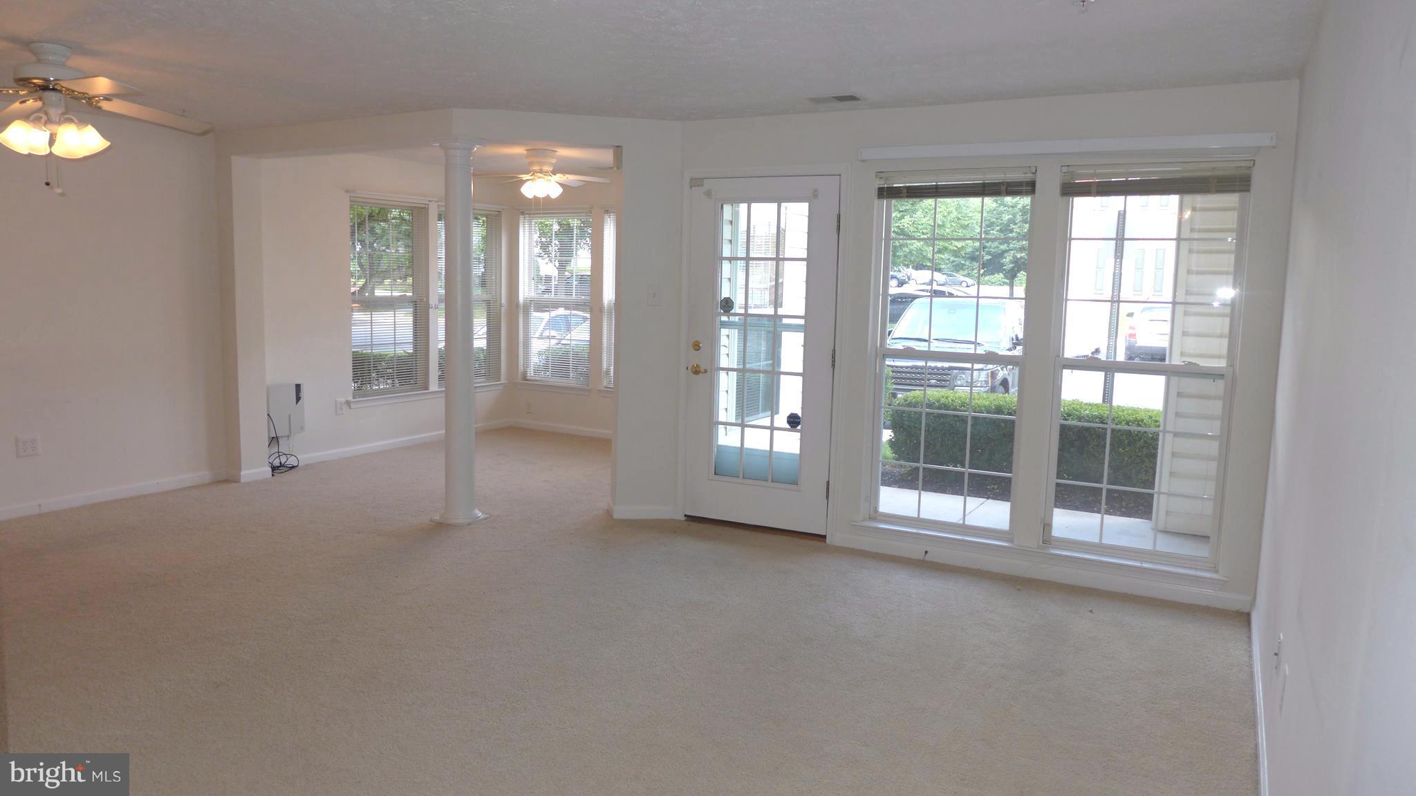 9746 Reese Farm Road, Unit 9746 Owings Mills, MD 21117 - Photo 5 of 22 a view of empty room with floor to ceiling window