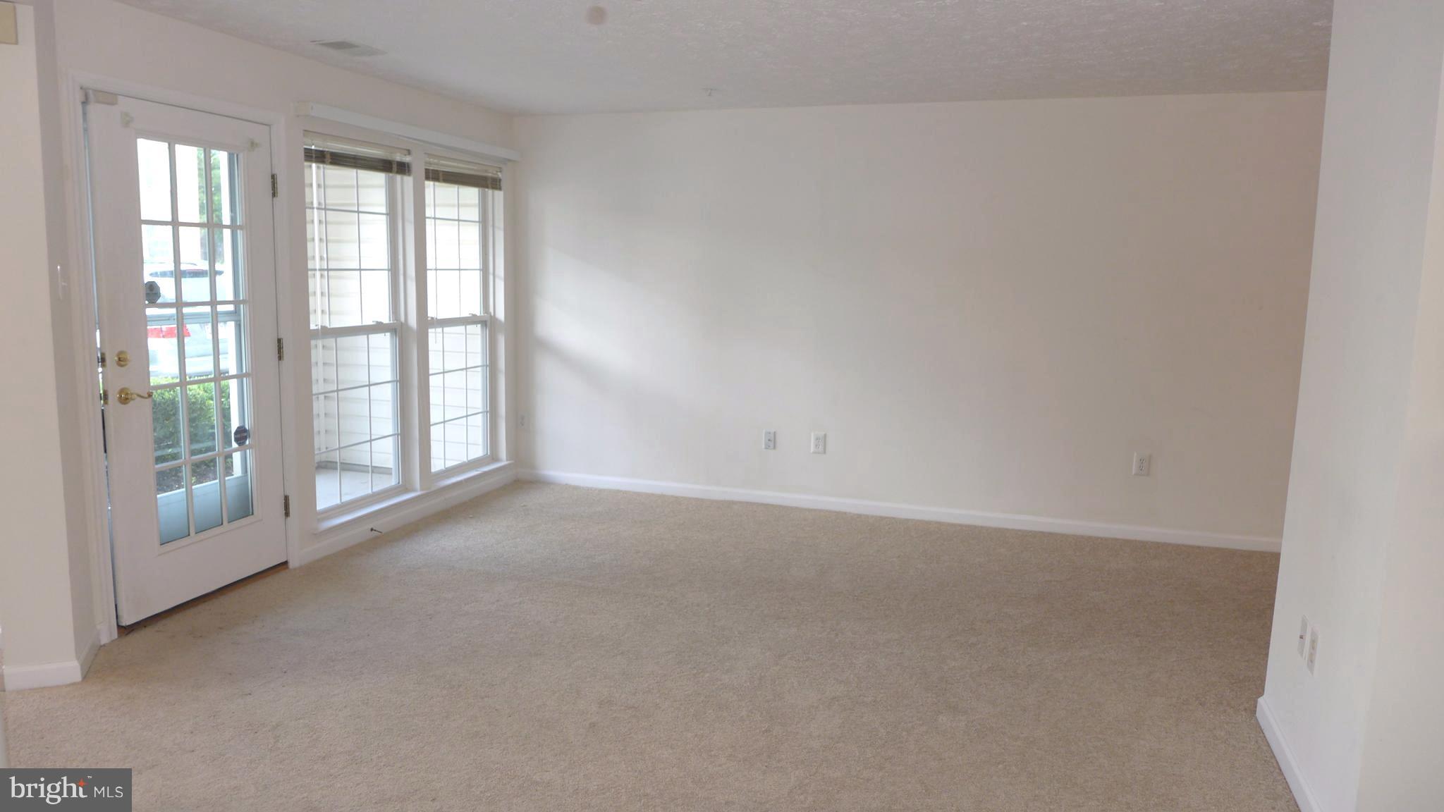 9746 Reese Farm Road, Unit 9746 Owings Mills, MD 21117 - Photo 7 of 22 an empty room with windows