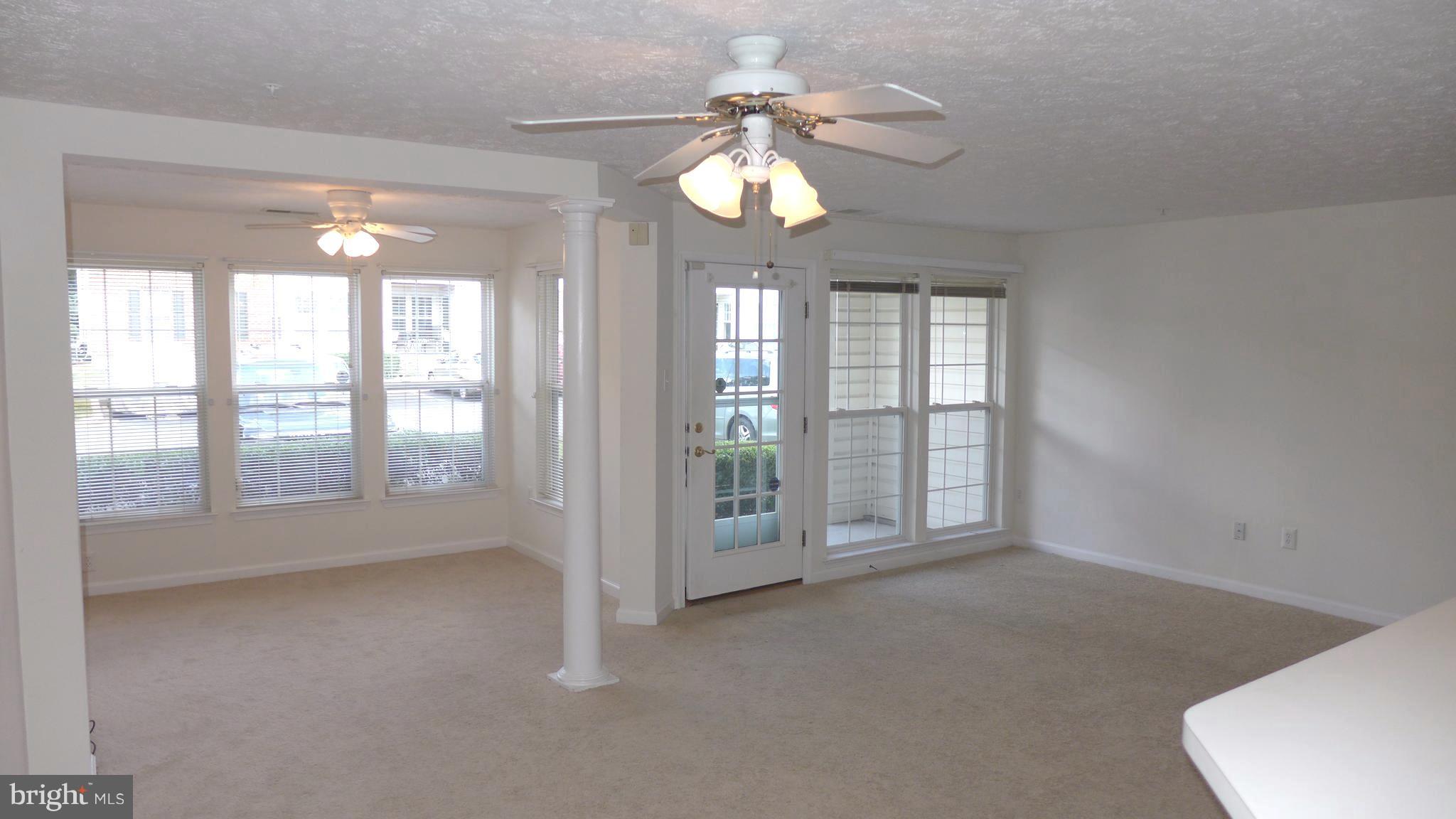 9746 Reese Farm Road, Unit 9746 Owings Mills, MD 21117 - Photo 8 of 22 a view of an empty room with window and bathroom