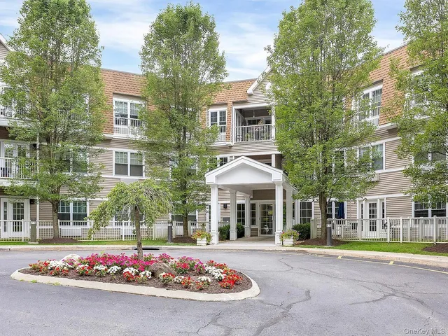 front view of a building with a garden