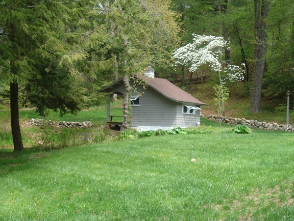 85 Brigantine Circle Norwell, MA 02061 - Photo 4 of 23 a view of a backyard with barn and large trees