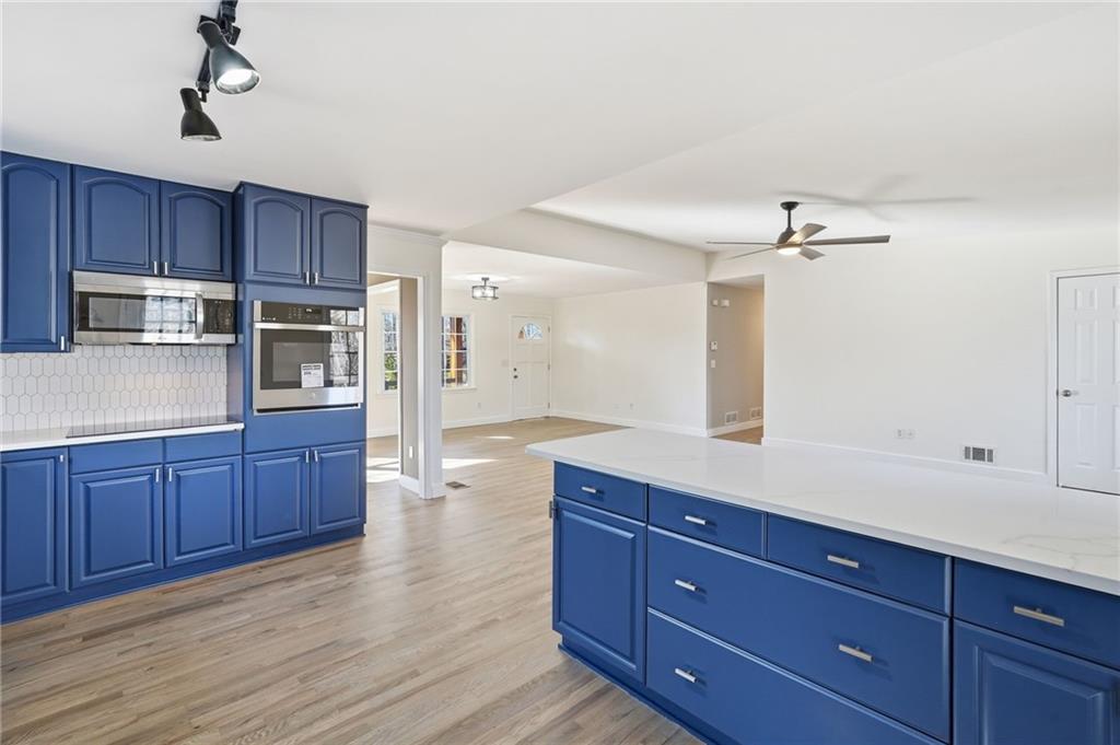 2810 Shaw Road Marietta, GA 30066 - Photo 12 of 38 a kitchen with wooden cabinets and stainless steel appliances