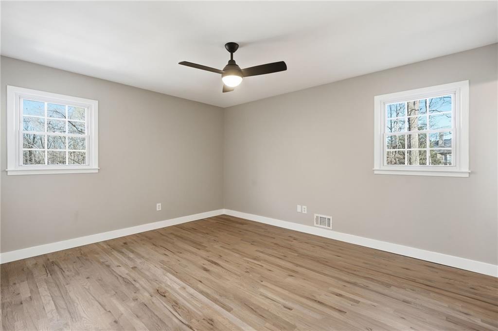 2810 Shaw Road Marietta, GA 30066 - Photo 18 of 38 wooden floor in an empty room with a window