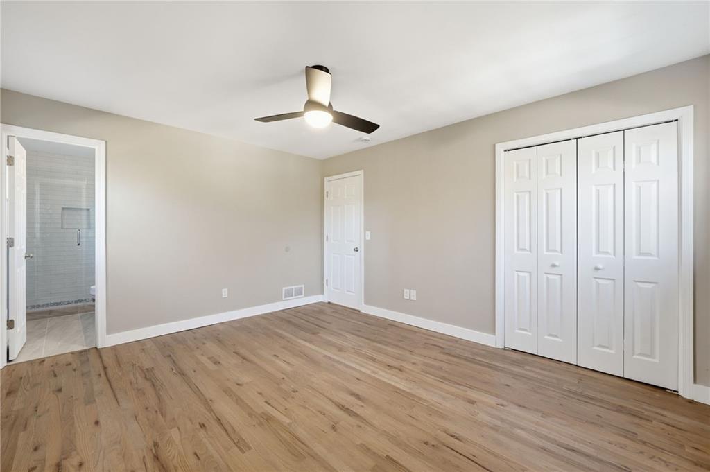 2810 Shaw Road Marietta, GA 30066 - Photo 19 of 38 an empty room with wooden floor and windows