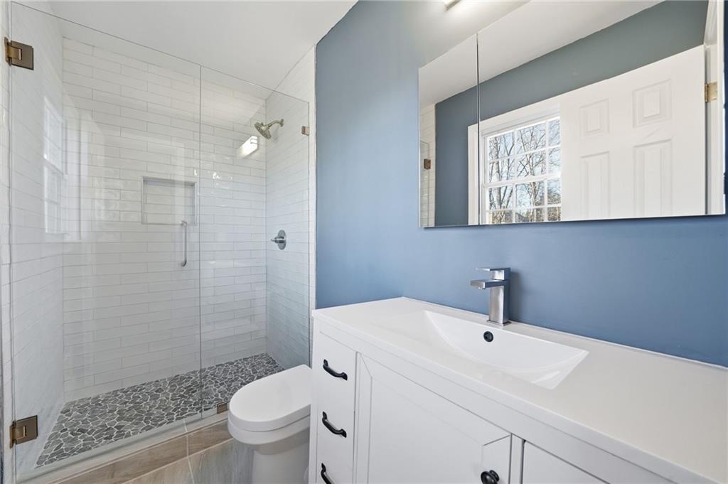2810 Shaw Road Marietta, GA 30066 - Photo 20 of 38 a bathroom with a sink toilet and shower