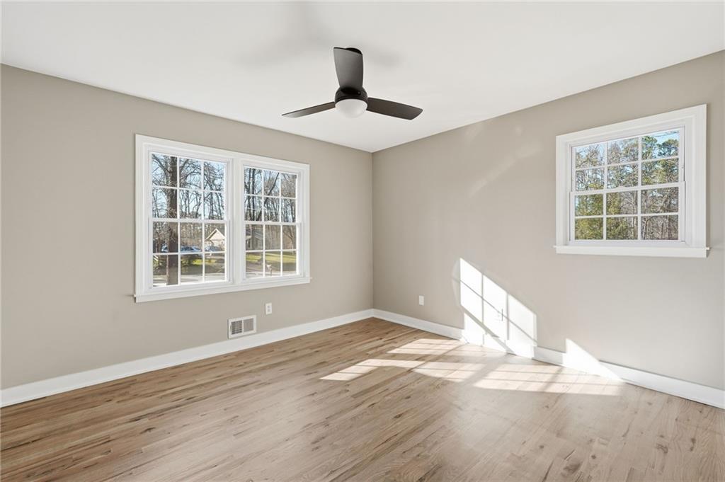 2810 Shaw Road Marietta, GA 30066 - Photo 22 of 38 a view of empty room with wooden floor and fan