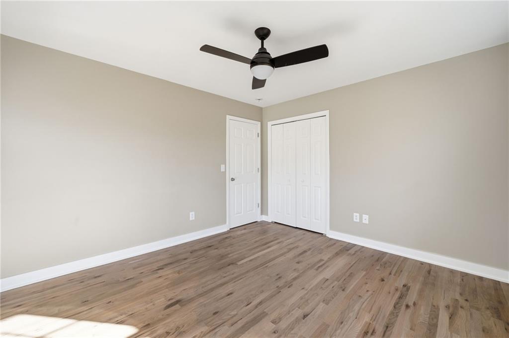 2810 Shaw Road Marietta, GA 30066 - Photo 23 of 38 a view of a room with wooden floor and a ceiling fan