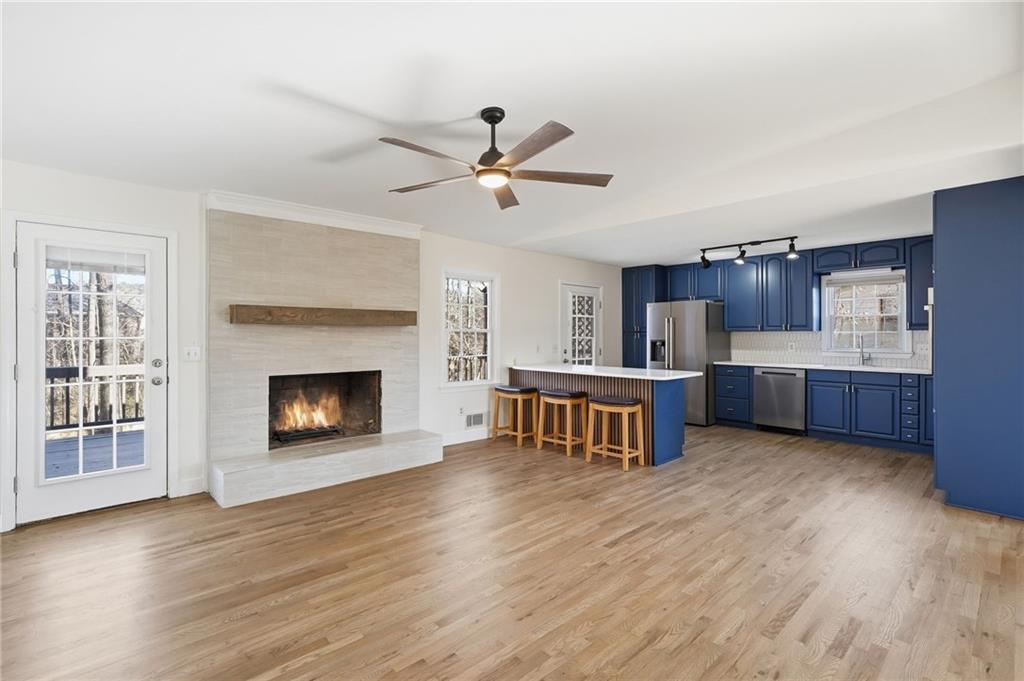 2810 Shaw Road Marietta, GA 30066 - Photo 3 of 38 a living room with stainless steel appliances kitchen island wooden floors and view living room
