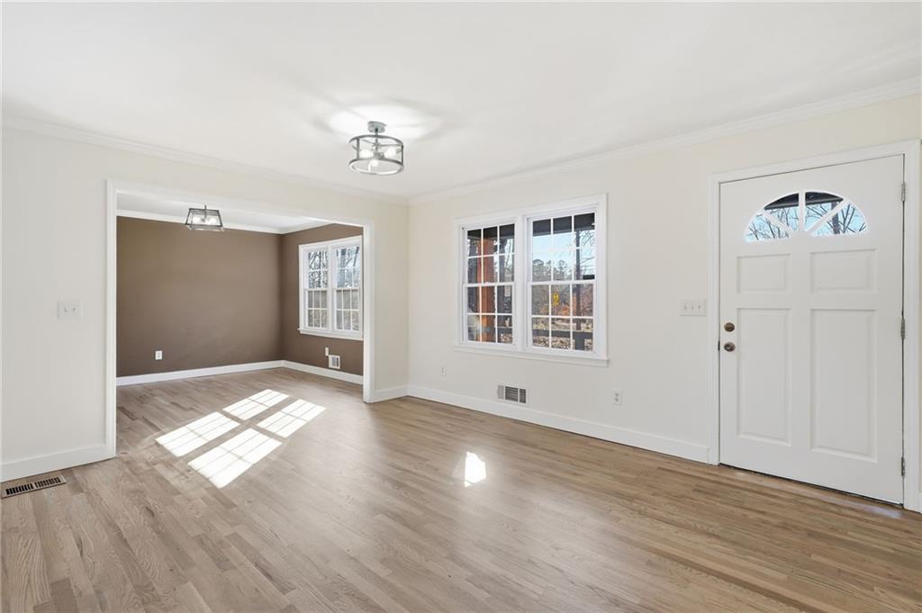 2810 Shaw Road Marietta, GA 30066 - Photo 4 of 38 wooden floor in an empty room with a window