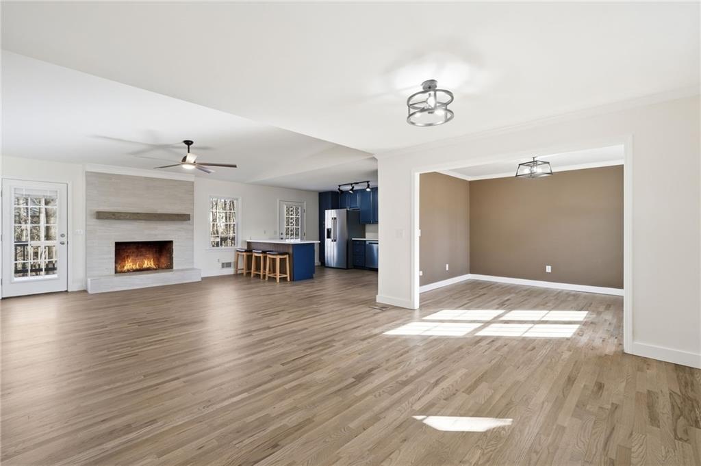 2810 Shaw Road Marietta, GA 30066 - Photo 5 of 38 a view of a livingroom with wooden floor and a fireplace