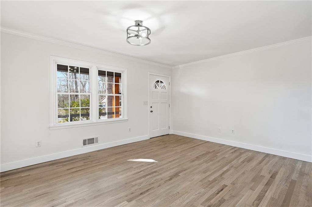 2810 Shaw Road Marietta, GA 30066 - Photo 6 of 38 a view of empty room with wooden floor and fan