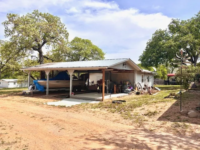 a backyard of a house with seating space