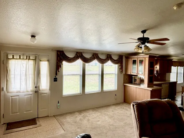 a view of entryway and kitchen