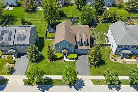 an aerial view of a house with a garden