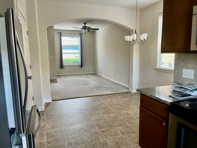 5424 Falling Leaf Lane Austin, TX 78744 - Photo 3 of 18 a view of a kitchen with a sink and dishwasher