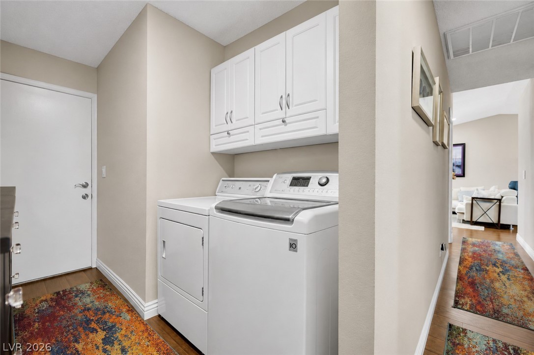 530 Grape Drive Henderson, NV 89015 - Photo 17 of 39 Functional laundry nook provides utility and storage, seamlessly connecting to main living areas.