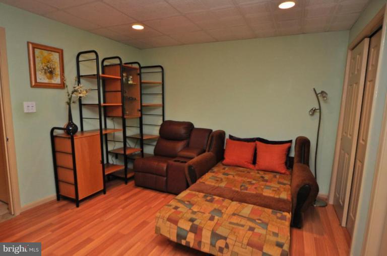 11322 Dockside Circle Reston, VA 20191 - Photo 11 of 22 a bedroom with furniture and wooden floor