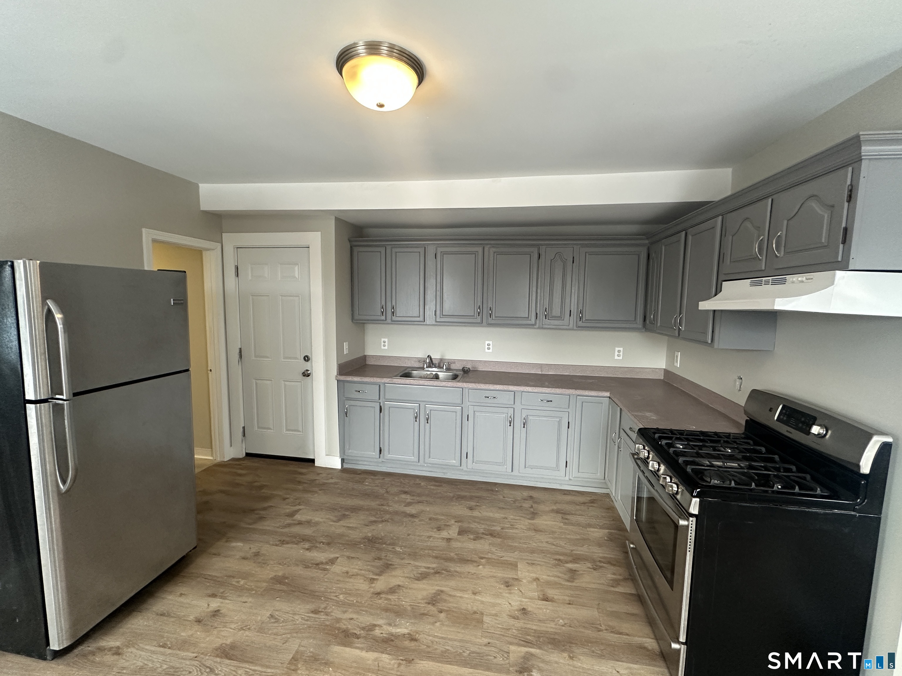 86 Gold Street, Unit 2S New Britain, CT 06053 - Photo 7 of 9 a kitchen with a refrigerator and a sink
