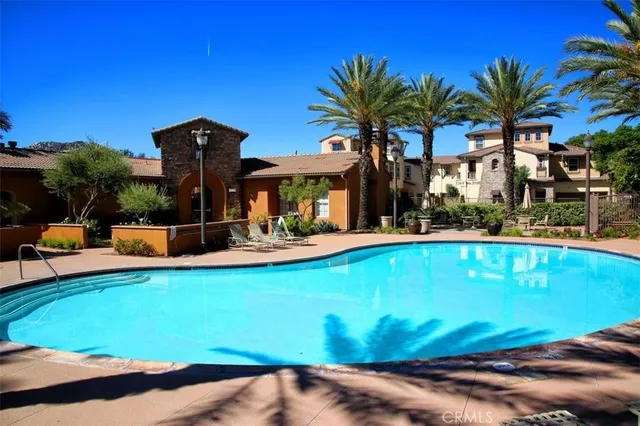 a view of a swimming pool with a patio