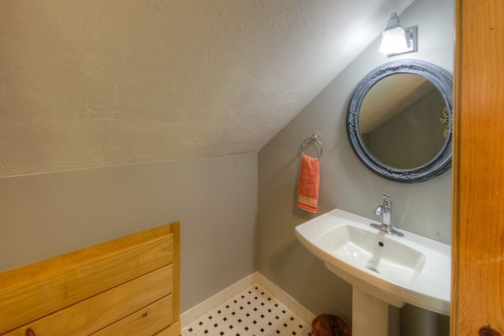 1 Factory Street Sandwich, MA 02563 - Photo 18 of 38 a bathroom with a sink and a mirror