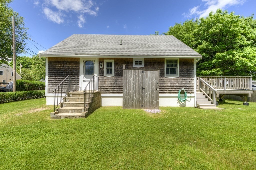 1 Factory Street Sandwich, MA 02563 - Photo 22 of 38 a front view of a house with a garden