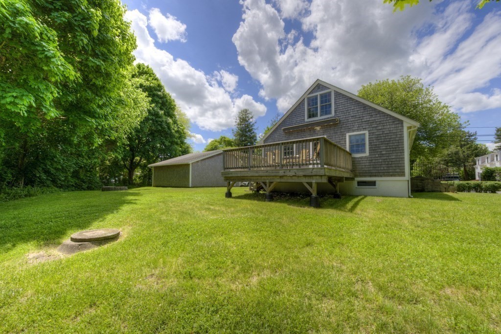 1 Factory Street Sandwich, MA 02563 - Photo 25 of 38 a front view of house with yard and trees in the background
