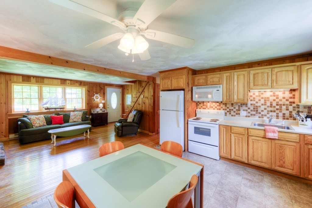 1 Factory Street Sandwich, MA 02563 - Photo 7 of 38 a kitchen with stainless steel appliances granite countertop a stove and refrigerator