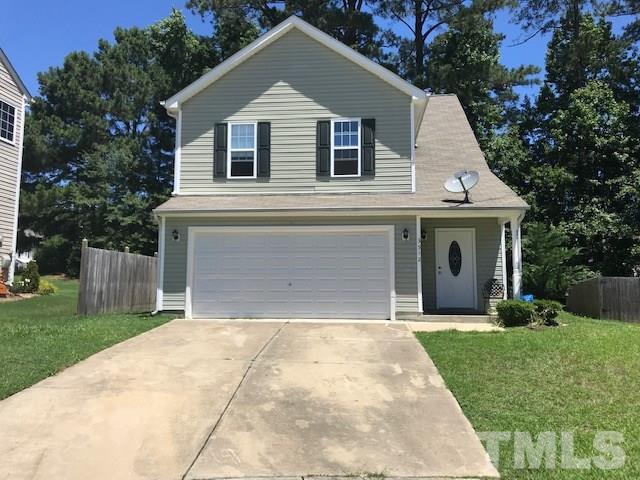 3512 Rendition Street Raleigh, NC 27610 - Photo 1 of 26 a front view of a house with a yard and garage