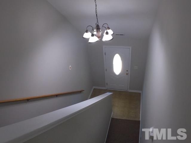 3512 Rendition Street Raleigh, NC 27610 - Photo 11 of 26 a view of a chandelier fan and livingroom view