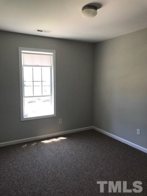3512 Rendition Street Raleigh, NC 27610 - Photo 17 of 26 an empty room with a window