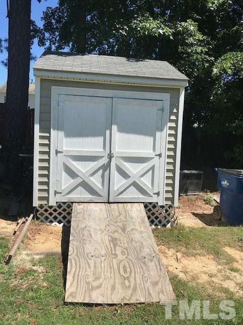 3512 Rendition Street Raleigh, NC 27610 - Photo 23 of 26 a view of house with backyard porch and furniture