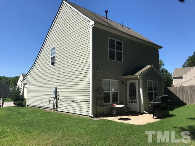 3512 Rendition Street Raleigh, NC 27610 - Photo 25 of 26 a front view of a house with a yard