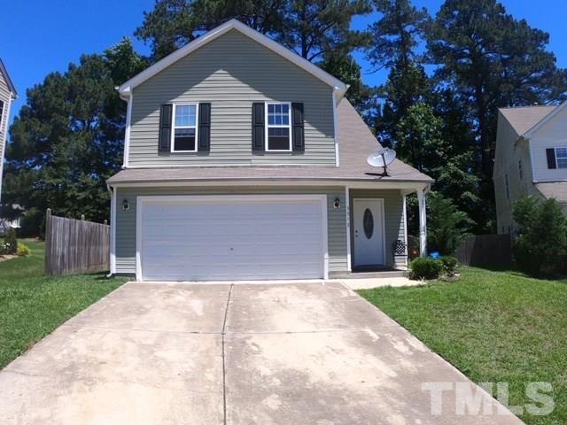 3512 Rendition Street Raleigh, NC 27610 - Photo 26 of 26 a front view of a house with a yard and garage