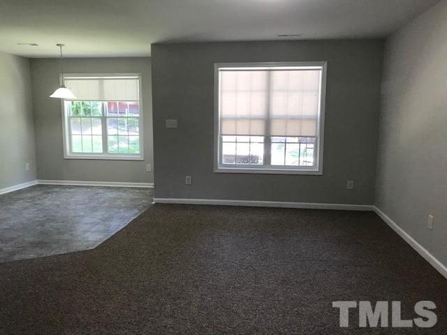 3512 Rendition Street Raleigh, NC 27610 - Photo 7 of 26 a view of a livingroom with an empty space and a window