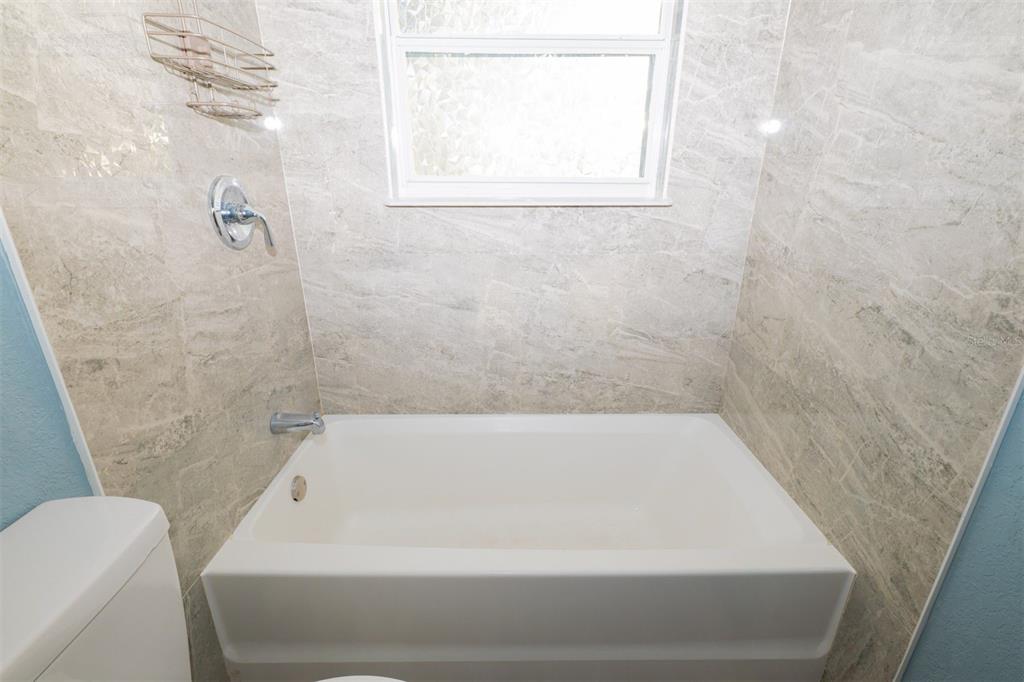 9330 Southeast Maricamp Road Ocala, FL 34472 - Photo 11 of 19 a bathroom with a bathtub
