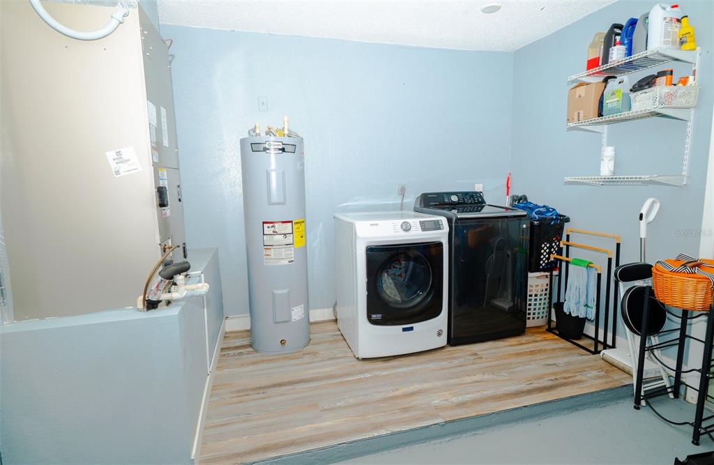 9330 Southeast Maricamp Road Ocala, FL 34472 - Photo 12 of 19 a utility room with dryer and washer