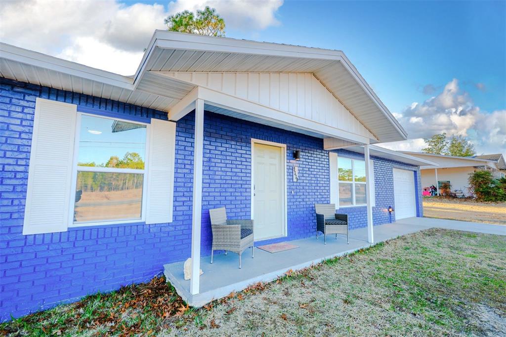 9330 Southeast Maricamp Road Ocala, FL 34472 - Photo 19 of 19 a view of an house with backyard porch and furniture