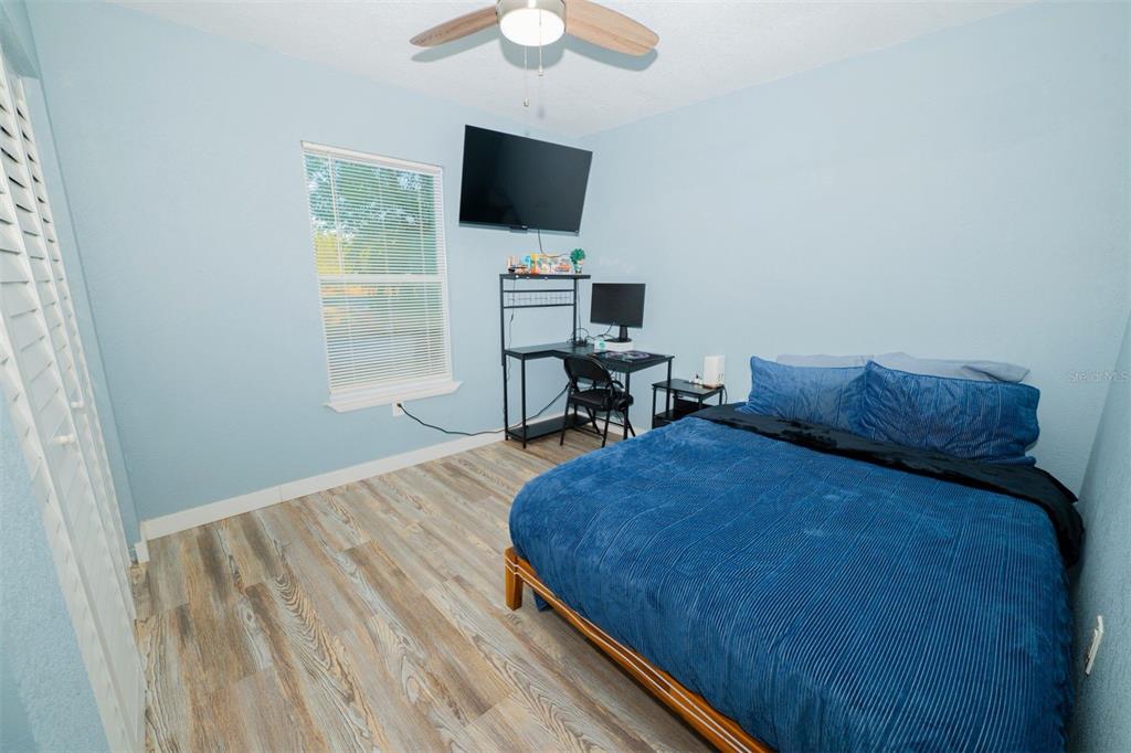 9330 Southeast Maricamp Road Ocala, FL 34472 - Photo 5 of 19 a living room with furniture and a flat screen tv