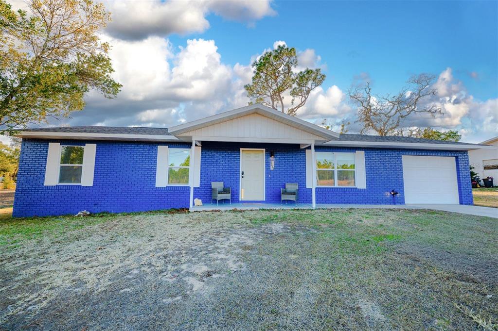 9330 Southeast Maricamp Road Ocala, FL 34472 - Photo 6 of 19 a view of a house with a yard