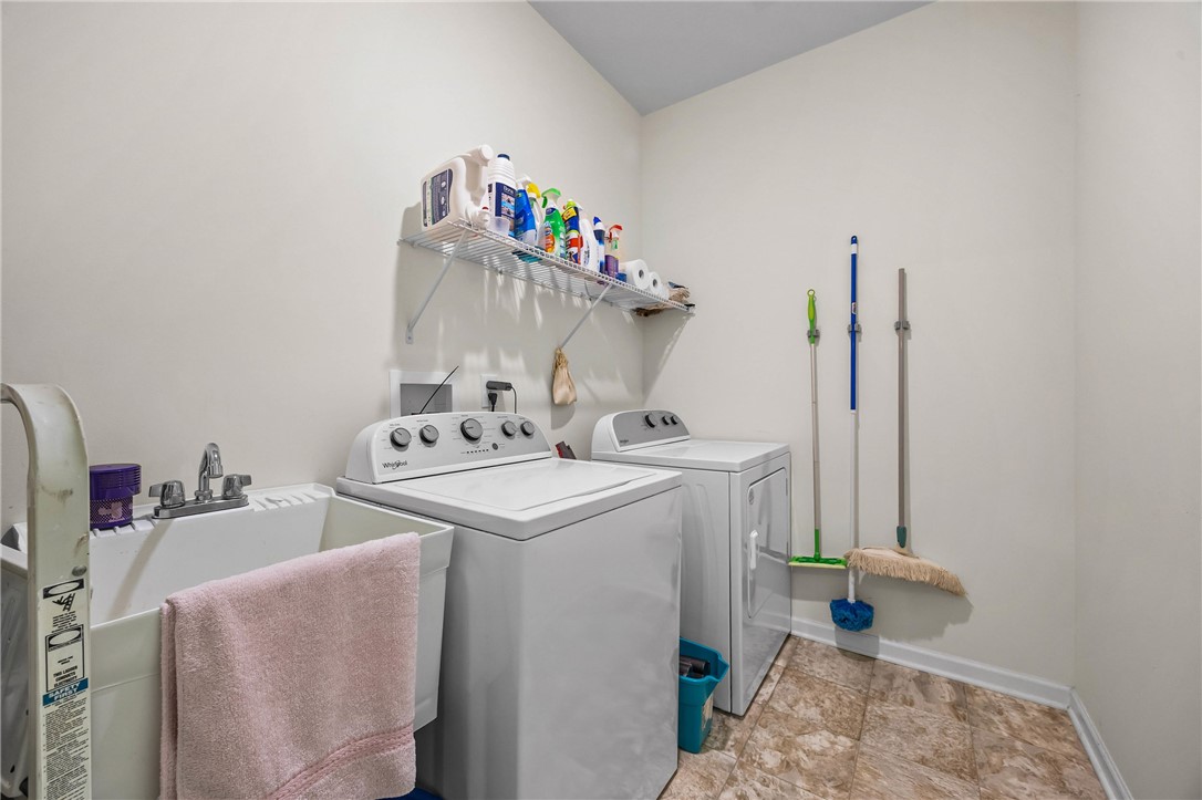 6002 Woodvine Rise Canandaigua, NY 14424 - Photo 31 of 50 first floor laundry right off the side hall and ga