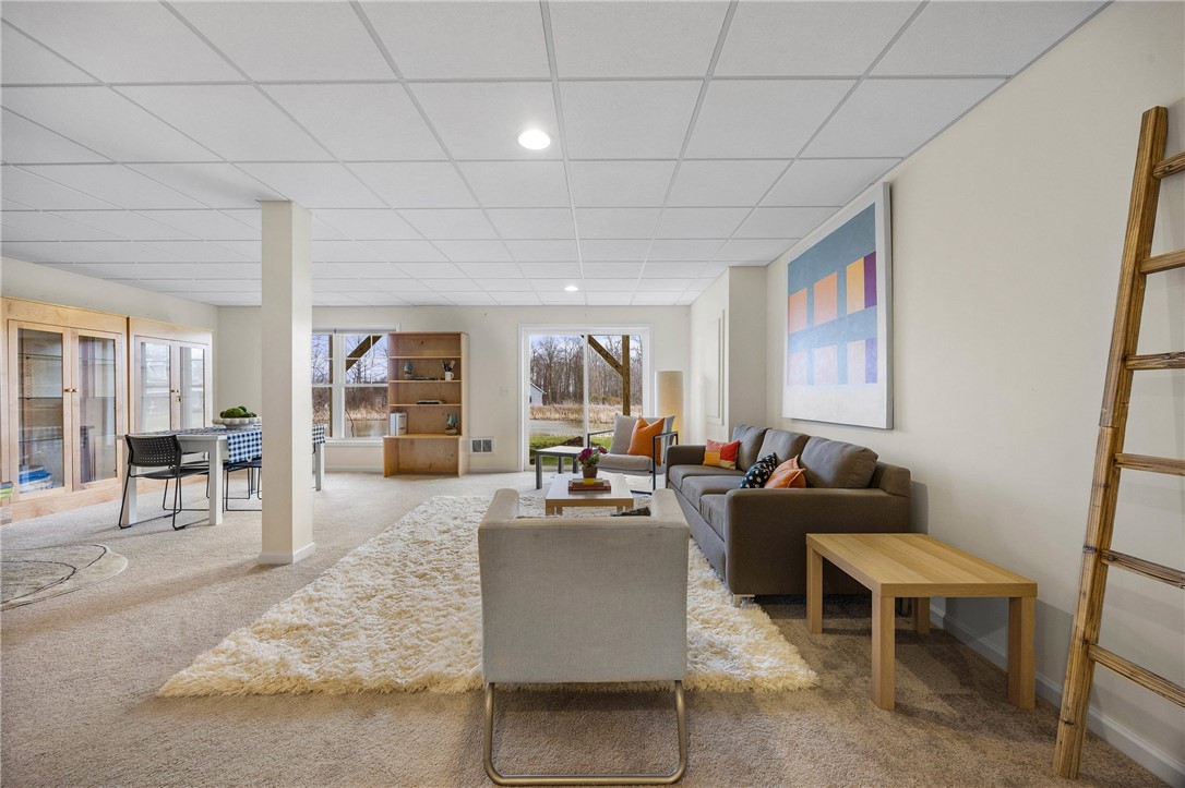 6002 Woodvine Rise Canandaigua, NY 14424 - Photo 32 of 50 Finished lower level with windows and walk- out