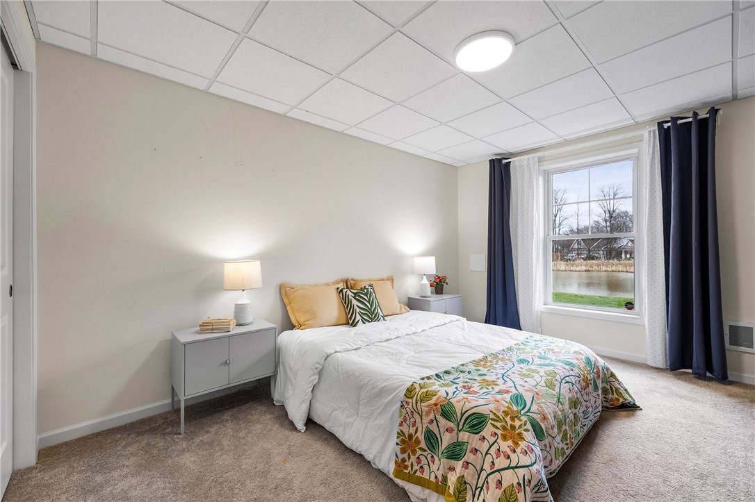 6002 Woodvine Rise Canandaigua, NY 14424 - Photo 40 of 50 Lower level bedroom with large closet