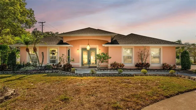 a front view of house with yard and seating space