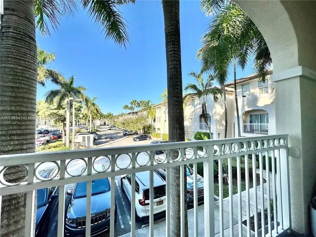a view of balcony with potted plants